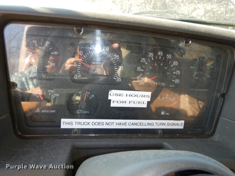 image for item J5564 2002 Sterling L8500 tree grapple truck