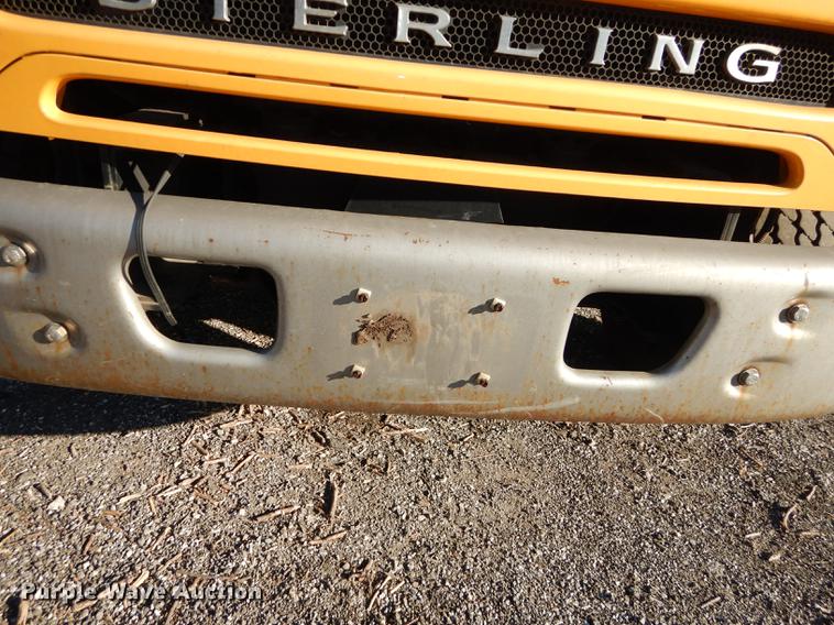 image for item J5564 2002 Sterling L8500 tree grapple truck