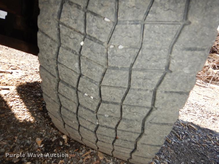 image for item J5564 2002 Sterling L8500 tree grapple truck