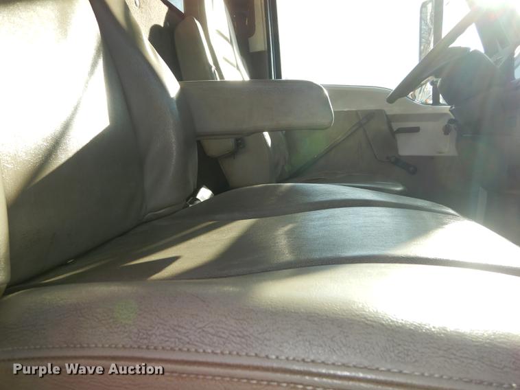 image for item J5564 2002 Sterling L8500 tree grapple truck