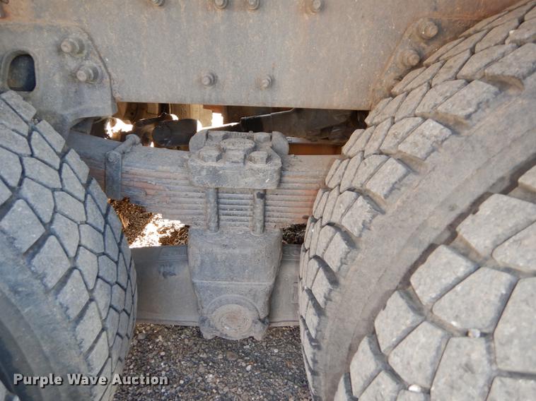 image for item J5564 2002 Sterling L8500 tree grapple truck