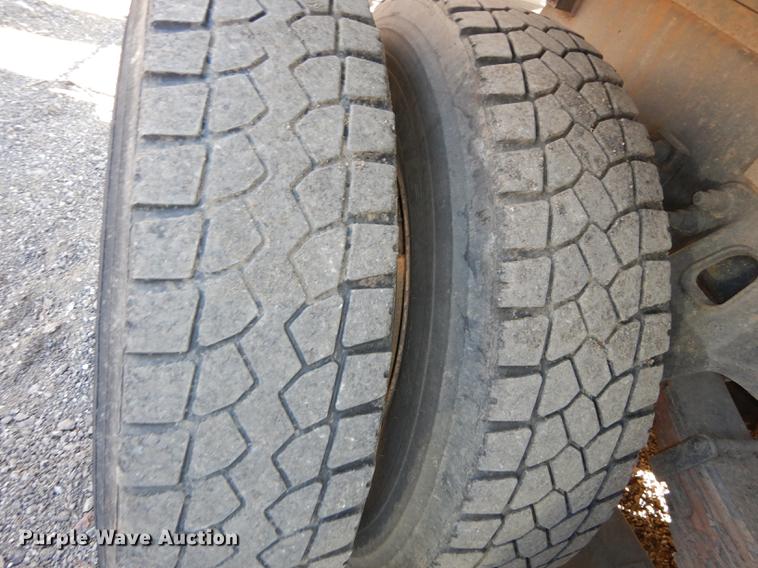 image for item J5564 2002 Sterling L8500 tree grapple truck