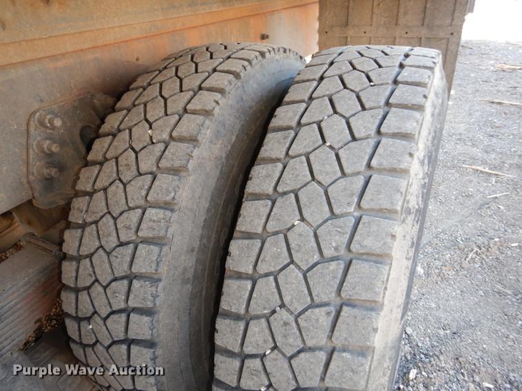 image for item J5564 2002 Sterling L8500 tree grapple truck