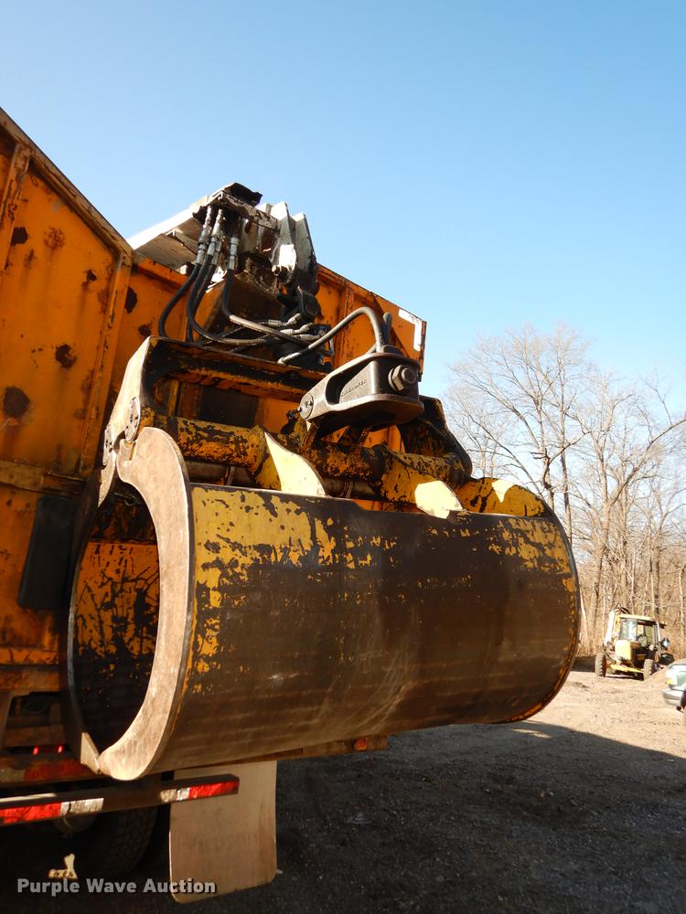 image for item J5564 2002 Sterling L8500 tree grapple truck