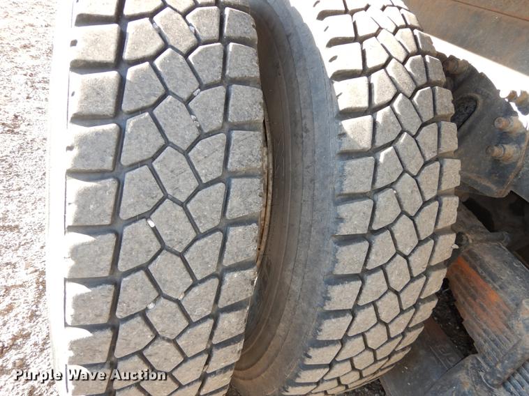 image for item J5564 2002 Sterling L8500 tree grapple truck