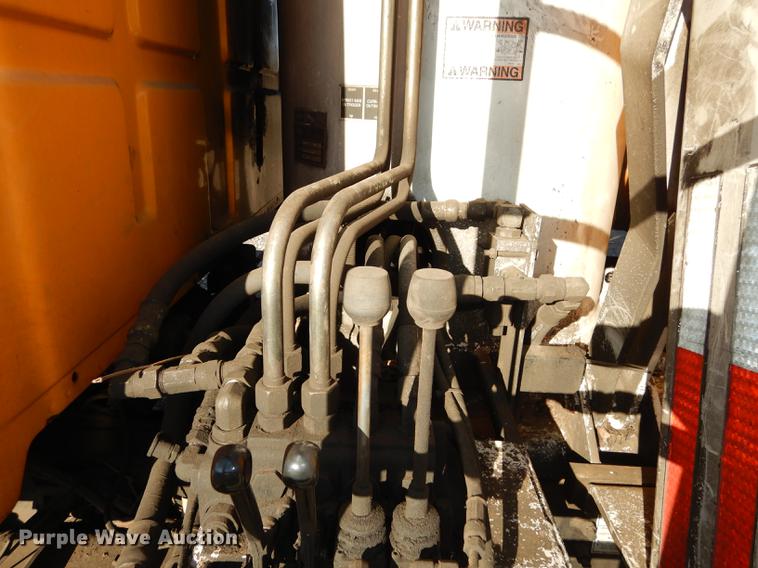 image for item J5564 2002 Sterling L8500 tree grapple truck