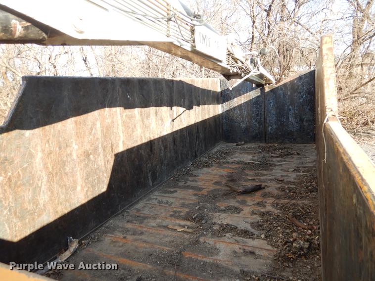 image for item J5564 2002 Sterling L8500 tree grapple truck