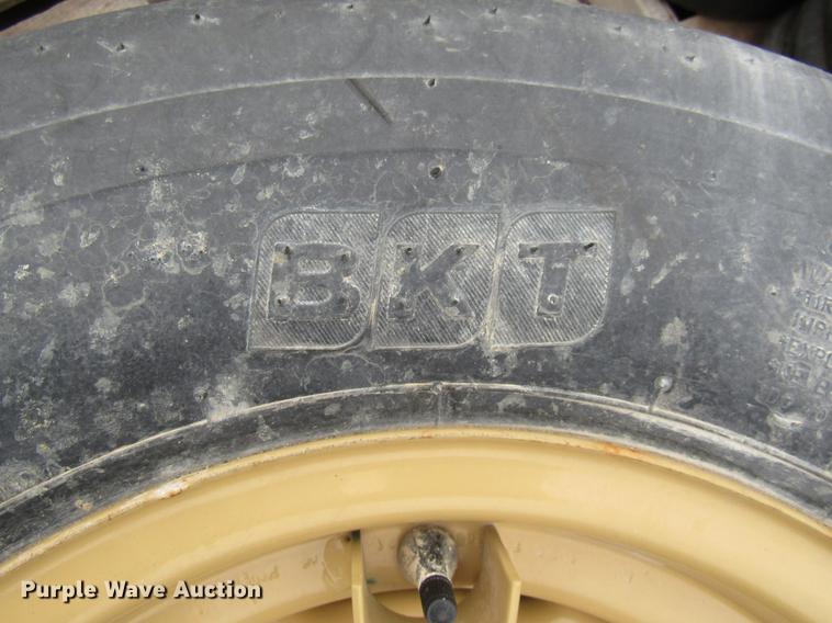 image for item EH9545 (4) BKT 11L-15 tires with six bolt wheels