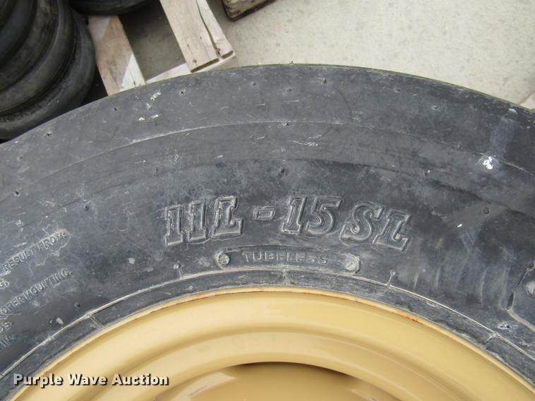 image for item EH9545 (4) BKT 11L-15 tires with six bolt wheels