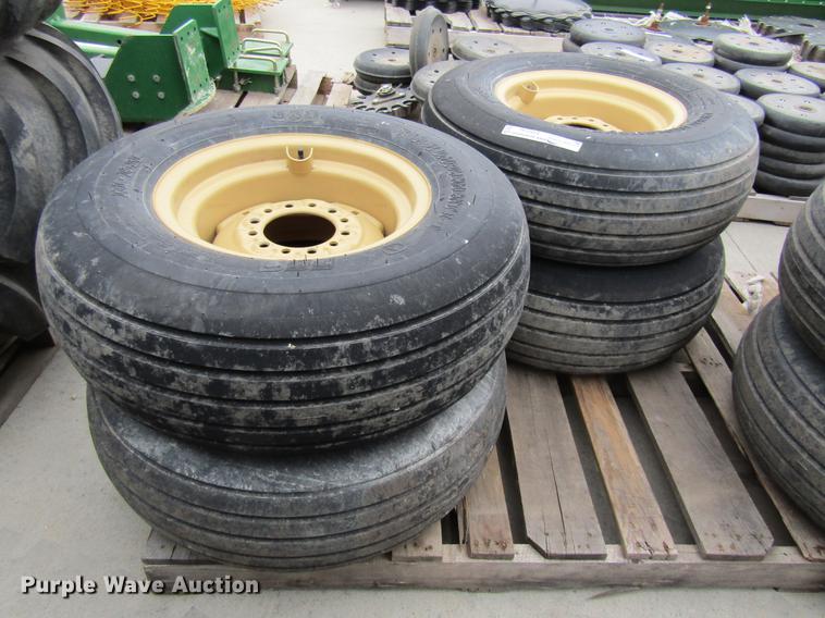image for item EH9546 (4) BKT 11L-15 tires with six bolt wheels