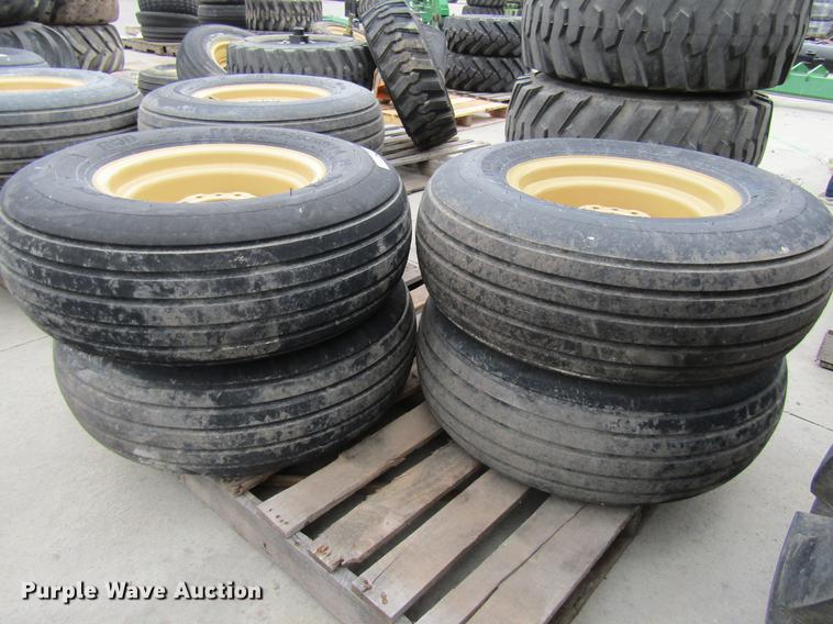 image for item EH9546 (4) BKT 11L-15 tires with six bolt wheels