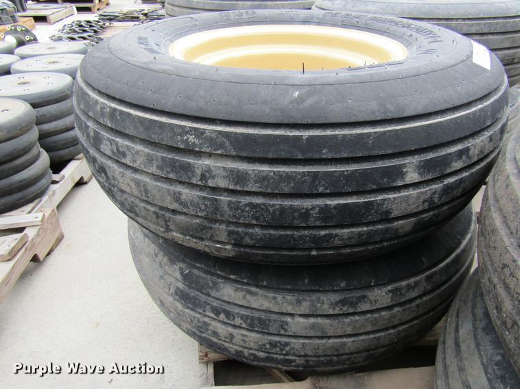 image for item EH9546 (4) BKT 11L-15 tires with six bolt wheels