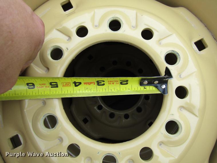 image for item EH9546 (4) BKT 11L-15 tires with six bolt wheels