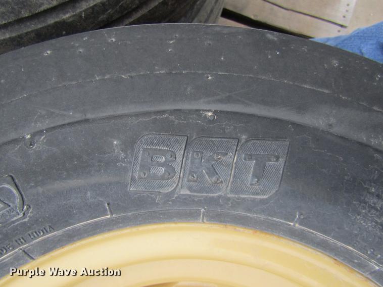 image for item EH9546 (4) BKT 11L-15 tires with six bolt wheels