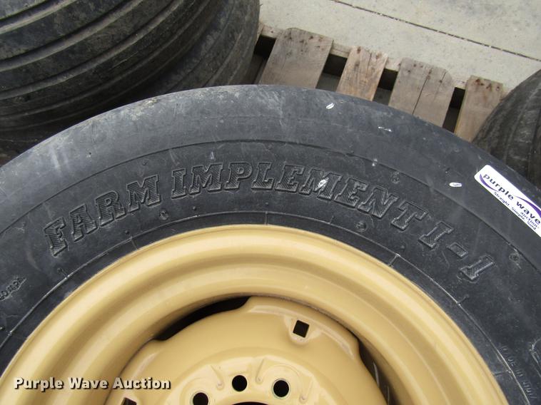 image for item EH9546 (4) BKT 11L-15 tires with six bolt wheels