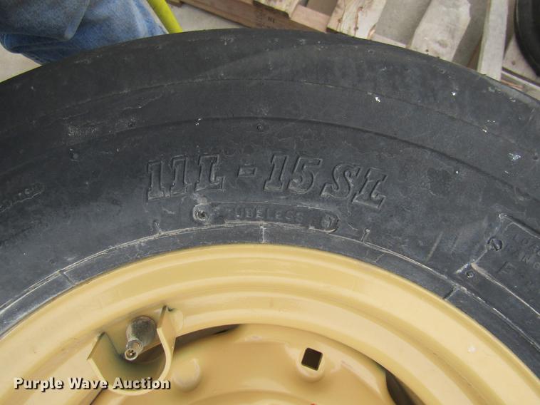 image for item EH9546 (4) BKT 11L-15 tires with six bolt wheels
