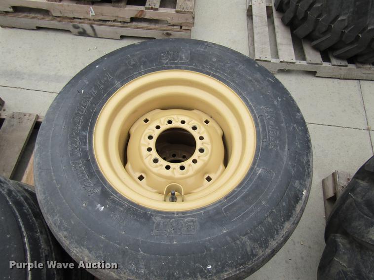 image for item EH9546 (4) BKT 11L-15 tires with six bolt wheels