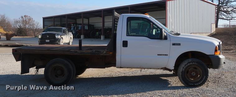 image for item DD9560 2000 Ford F350 Super Duty flatbed pickup truck