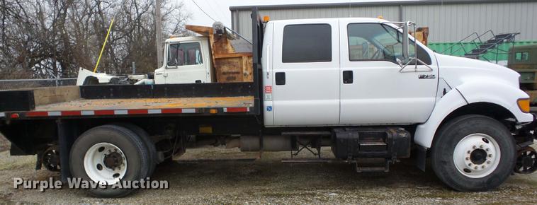 image for item K6291 2001 Ford F750 Crew Cab flatbed truck with DMF Rail Gear