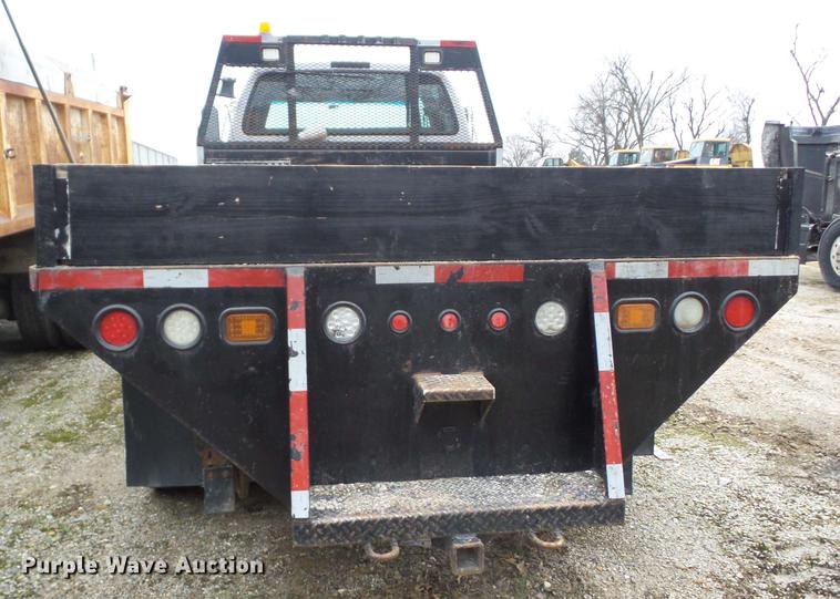 2001 Ford F750 Crew Cab flatbed truck with DMF Rail Gear in Carl