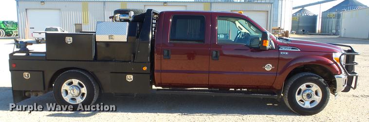 image for item DC0504 2013 Ford F350 Super Duty Crew Cab flatbed pickup truck
