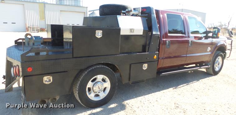 image for item DC0504 2013 Ford F350 Super Duty Crew Cab flatbed pickup truck