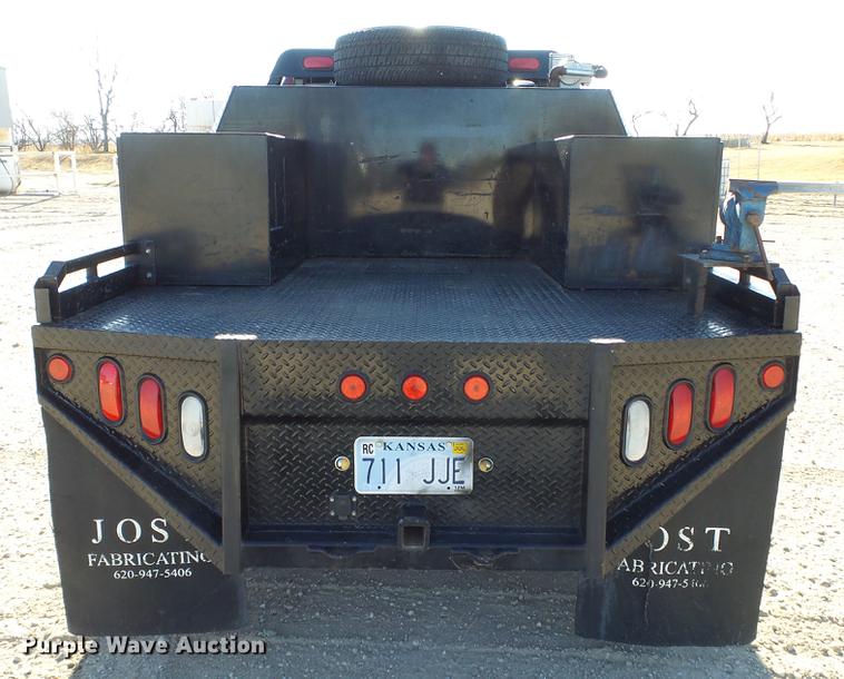 image for item DC0504 2013 Ford F350 Super Duty Crew Cab flatbed pickup truck