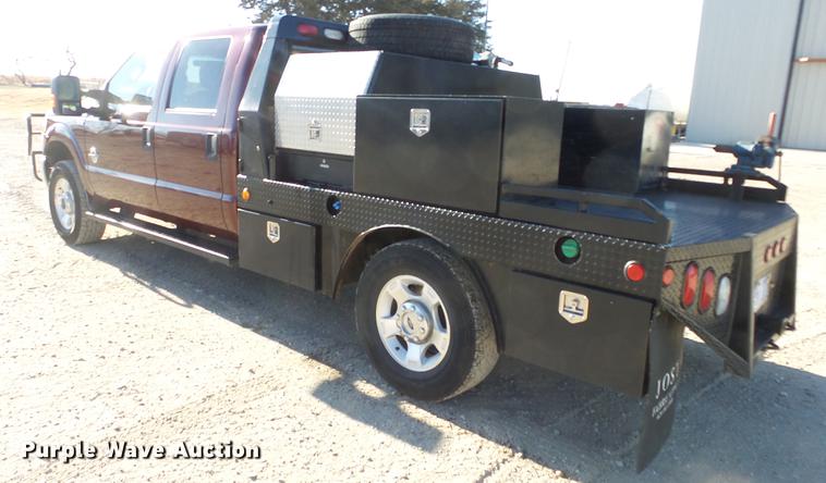 image for item DC0504 2013 Ford F350 Super Duty Crew Cab flatbed pickup truck