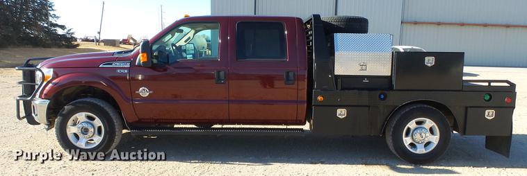 image for item DC0504 2013 Ford F350 Super Duty Crew Cab flatbed pickup truck