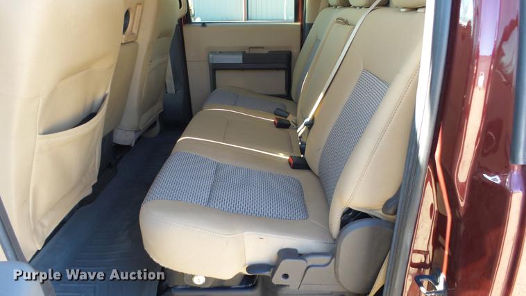 image for item DC0504 2013 Ford F350 Super Duty Crew Cab flatbed pickup truck