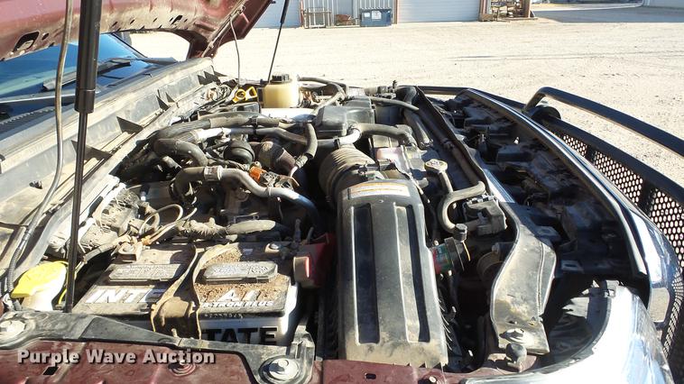 image for item DC0504 2013 Ford F350 Super Duty Crew Cab flatbed pickup truck