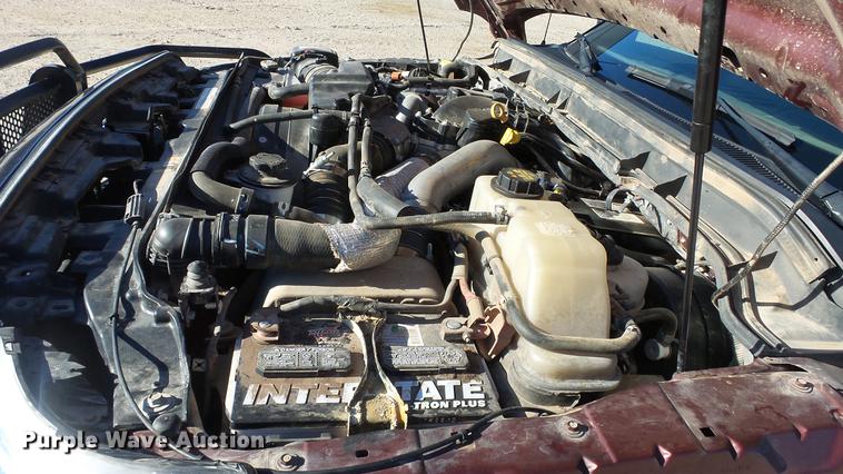 image for item DC0504 2013 Ford F350 Super Duty Crew Cab flatbed pickup truck