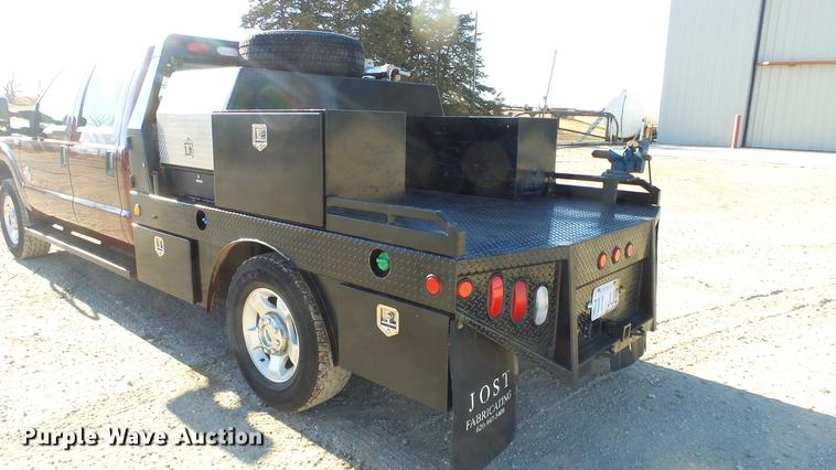 image for item DC0504 2013 Ford F350 Super Duty Crew Cab flatbed pickup truck