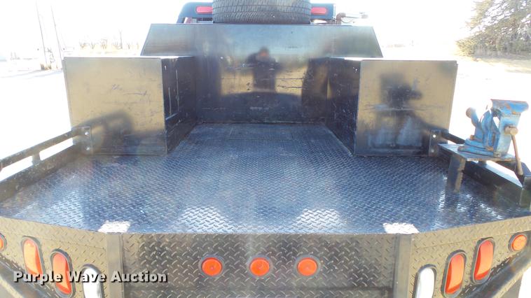 image for item DC0504 2013 Ford F350 Super Duty Crew Cab flatbed pickup truck