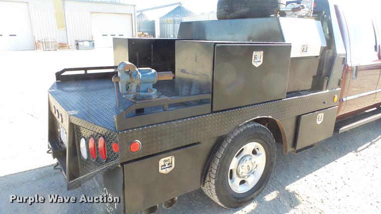 image for item DC0504 2013 Ford F350 Super Duty Crew Cab flatbed pickup truck