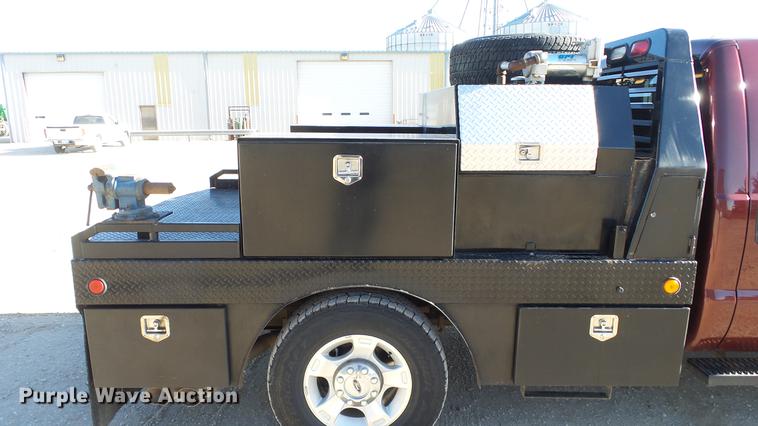 image for item DC0504 2013 Ford F350 Super Duty Crew Cab flatbed pickup truck