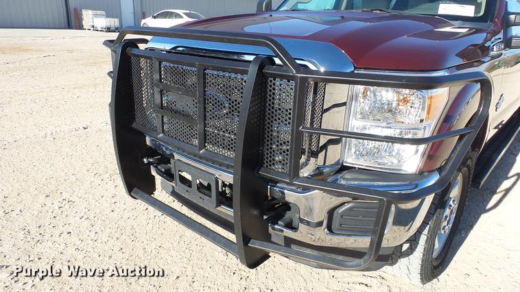 image for item DC0504 2013 Ford F350 Super Duty Crew Cab flatbed pickup truck