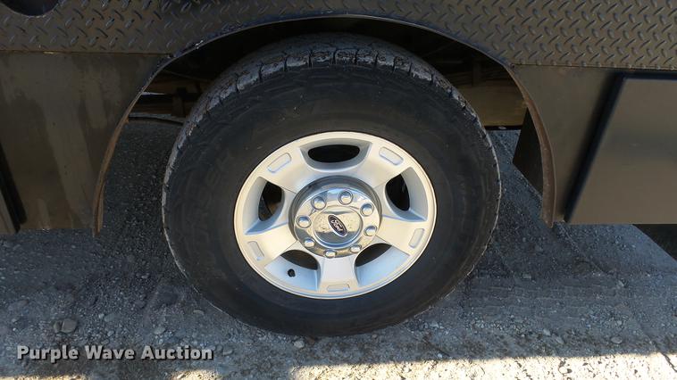 image for item DC0504 2013 Ford F350 Super Duty Crew Cab flatbed pickup truck