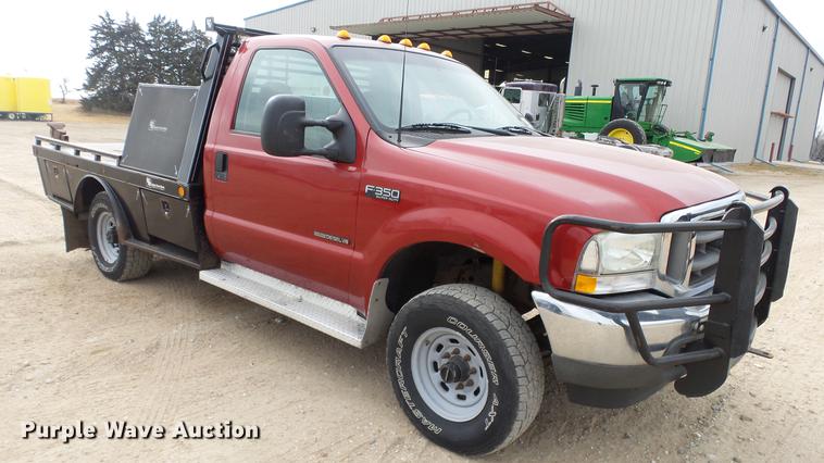 image for item DC2351 2002 Ford F350 Super Duty XLT flatbed pickup truck