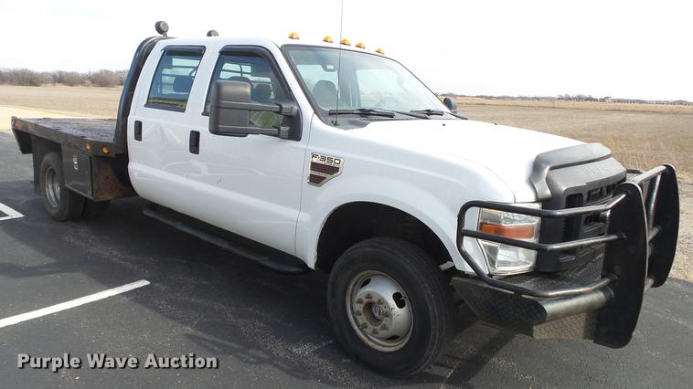 image for item DC0562 2009 Ford F350 Super Duty Crew Cab flatbed truck
