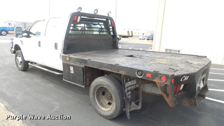 image for item DC0562 2009 Ford F350 Super Duty Crew Cab flatbed truck