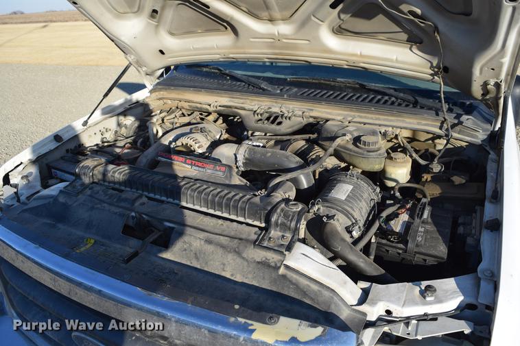 image for item DC7746 2004 Ford F350 Super Duty XLT Crew Cab utility bed pickup truck