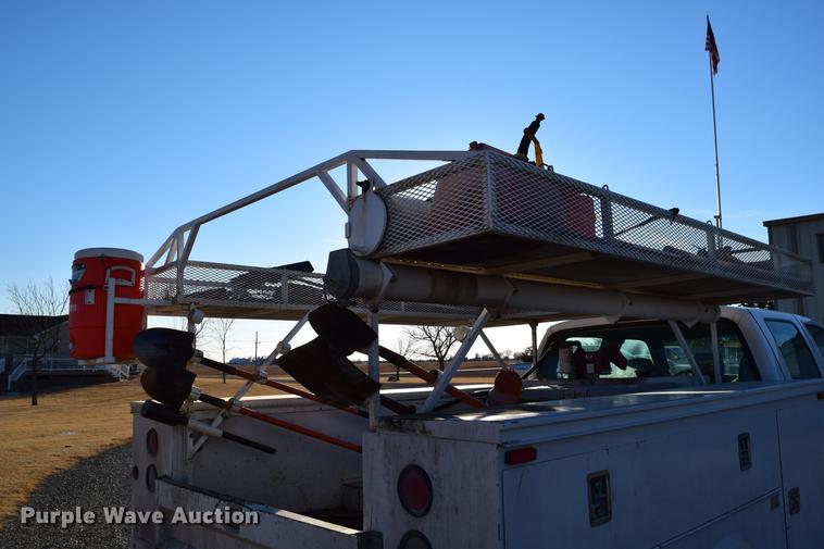 image for item DC7746 2004 Ford F350 Super Duty XLT Crew Cab utility bed pickup truck