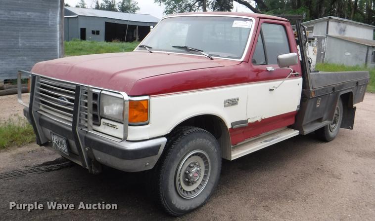 image for item DB3941 1989 Ford F250 XLT Lariat flatbed pickup truck
