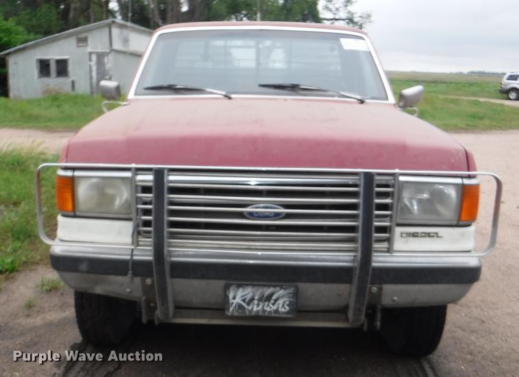 image for item DB3941 1989 Ford F250 XLT Lariat flatbed pickup truck