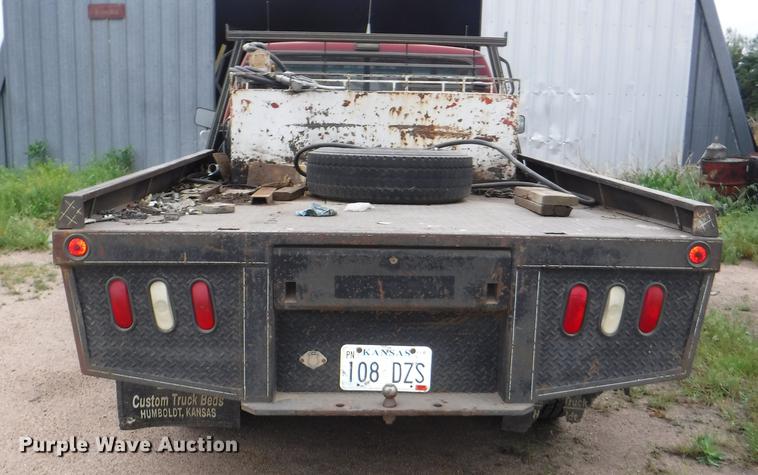 image for item DB3941 1989 Ford F250 XLT Lariat flatbed pickup truck