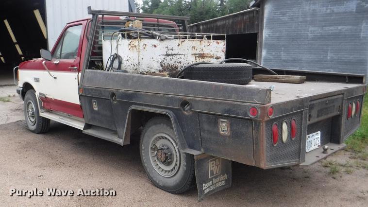 image for item DB3941 1989 Ford F250 XLT Lariat flatbed pickup truck