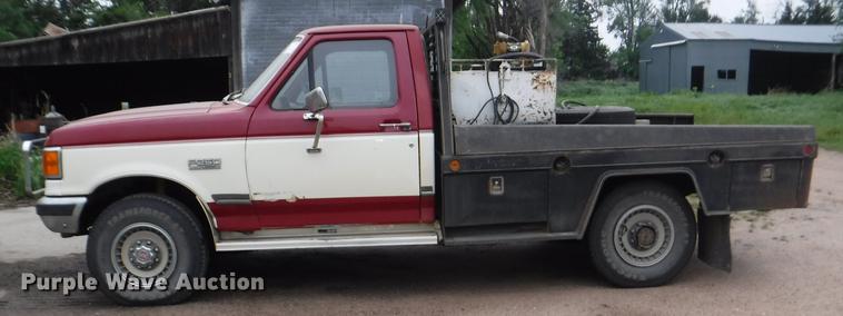 image for item DB3941 1989 Ford F250 XLT Lariat flatbed pickup truck