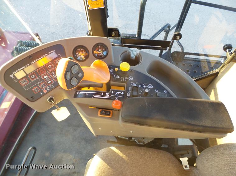 image for item BJ9798 2014 MacDon M205 self-propelled windrower