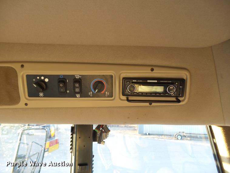 image for item BJ9798 2014 MacDon M205 self-propelled windrower